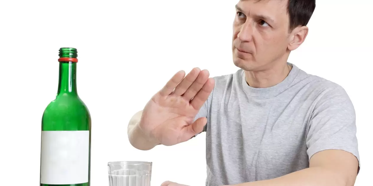 A man pushes alcohol